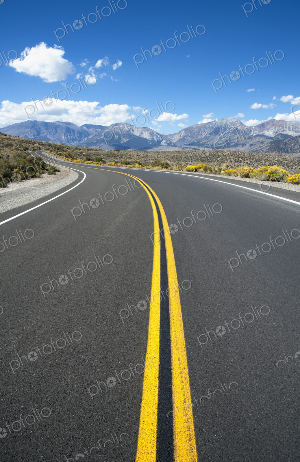 Empty road, Highway 120, curving around corner, near Mono Lakes.
