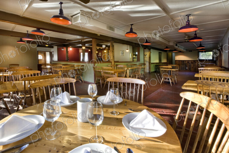 Empty tables and chairs in restaurant