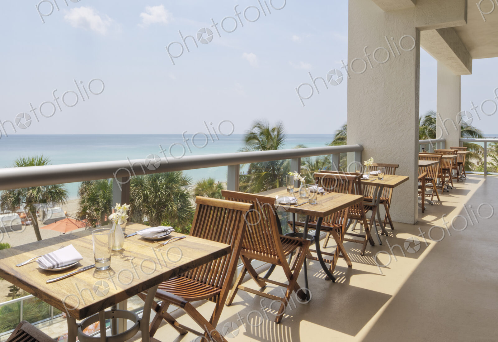 Empty tables on restaurant balcony