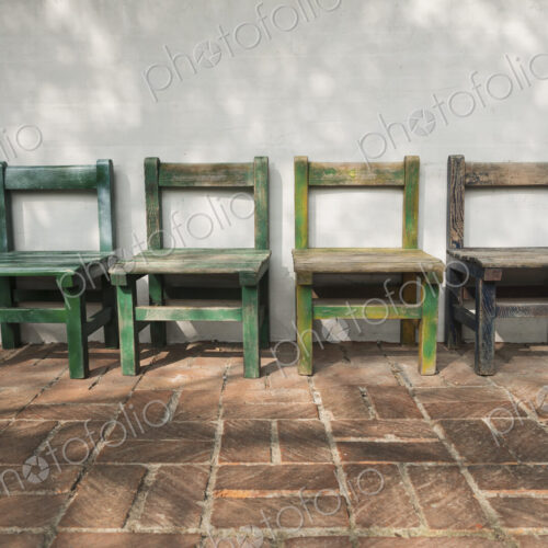 Empty wooden chairs outdoors