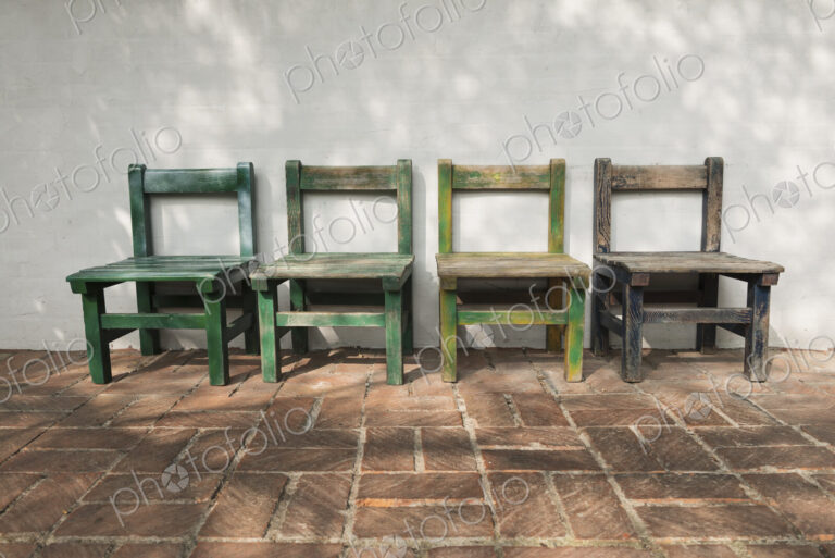 Empty wooden chairs outdoors