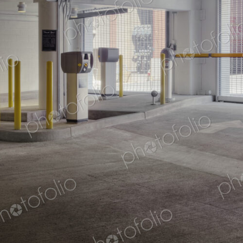 Entrance to car park with automated barrier. Entrance to car park with automated barrier.