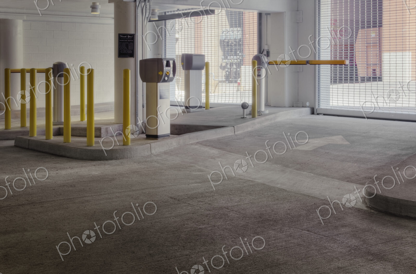 Entrance to car park with automated barrier.