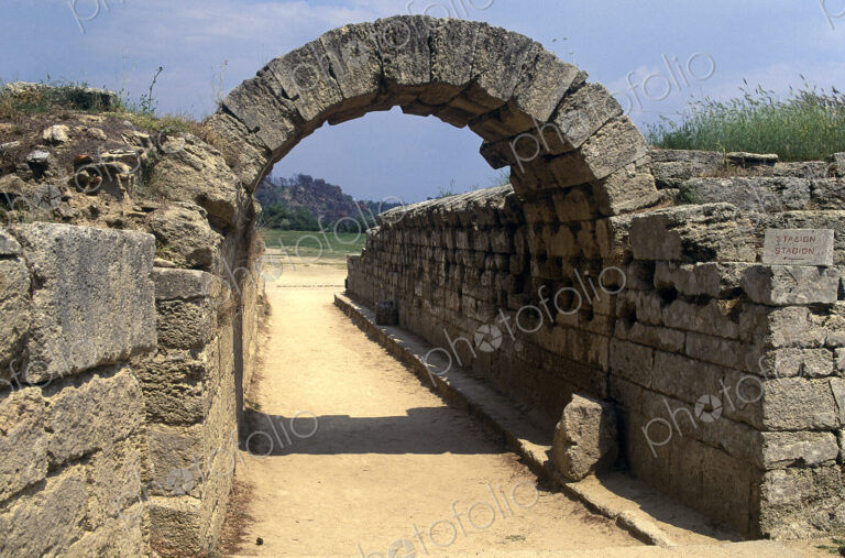 Entrance to the original Olympic Stadium at Olympia, an archway and stone walls
