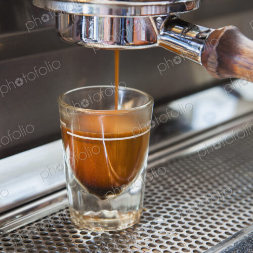 Espresso shot being poured from espresso machine, Seattle Espresso shot being poured from espresso machine, Seattle
