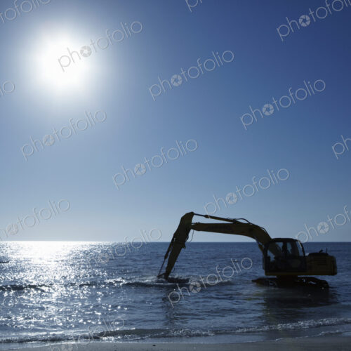Excavator Digging in the Ocean
