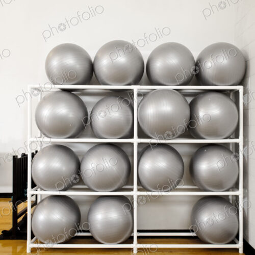 Exercise Balls in a rack Exercise Balls in a rack