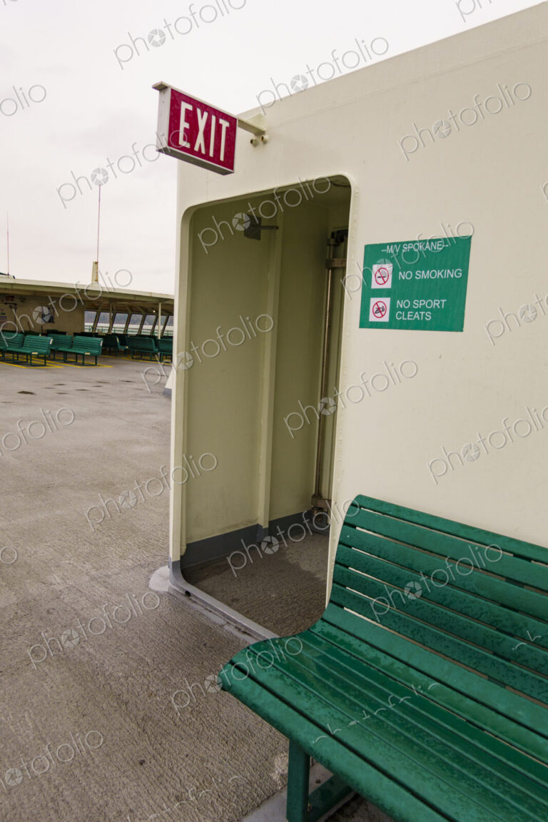 Exit sign and bench, Puget Sound ferry crossing from Edmonds to Kingston, WA USA