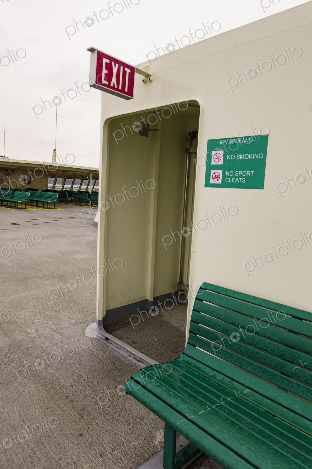 Exit sign and bench, Puget Sound ferry crossing from Edmonds to Kingston, WA USA