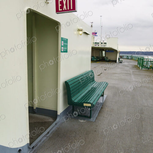 Exit sign and bench, Puget Sound ferry crossing from Edmonds to Kingston, WA USA Exit sign and bench, Puget Sound ferry crossing from Edmonds to Kingston, WA USA