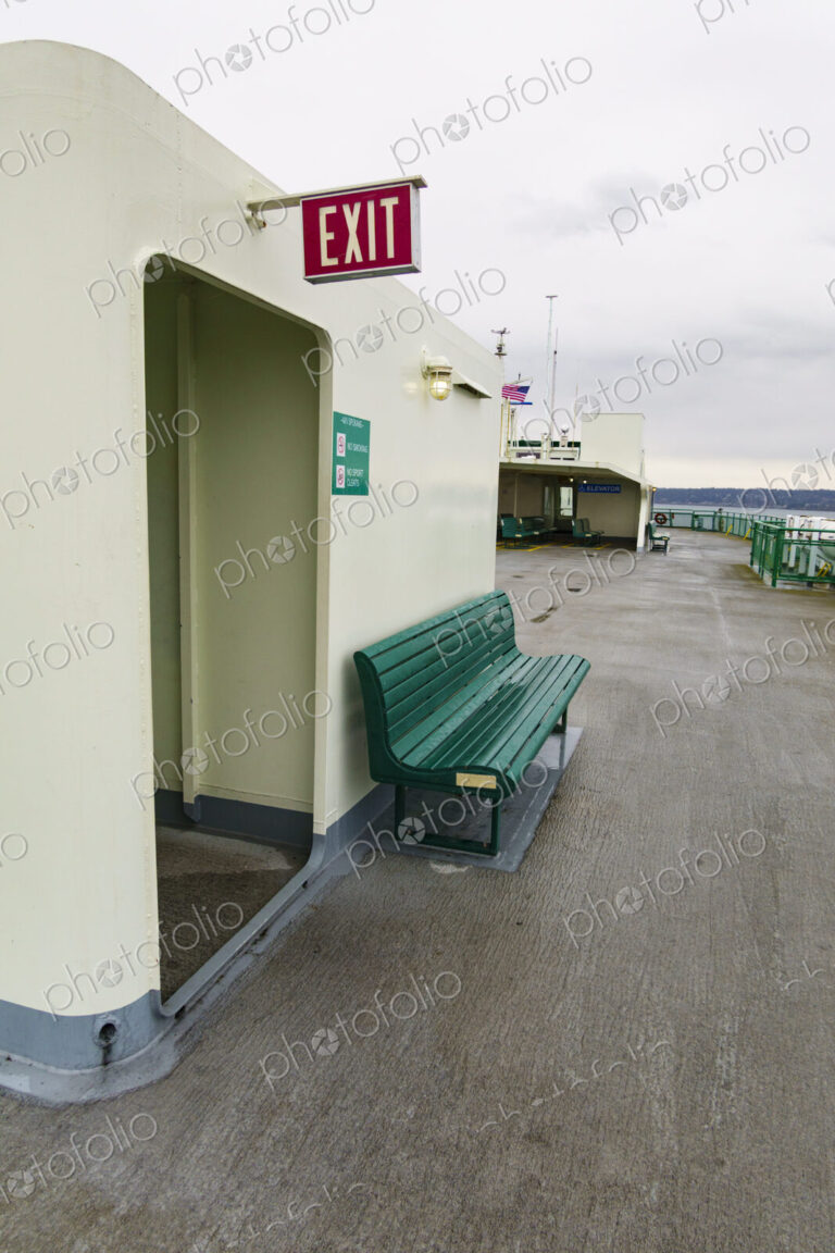 Exit sign and bench, Puget Sound ferry crossing from Edmonds to Kingston, WA USA