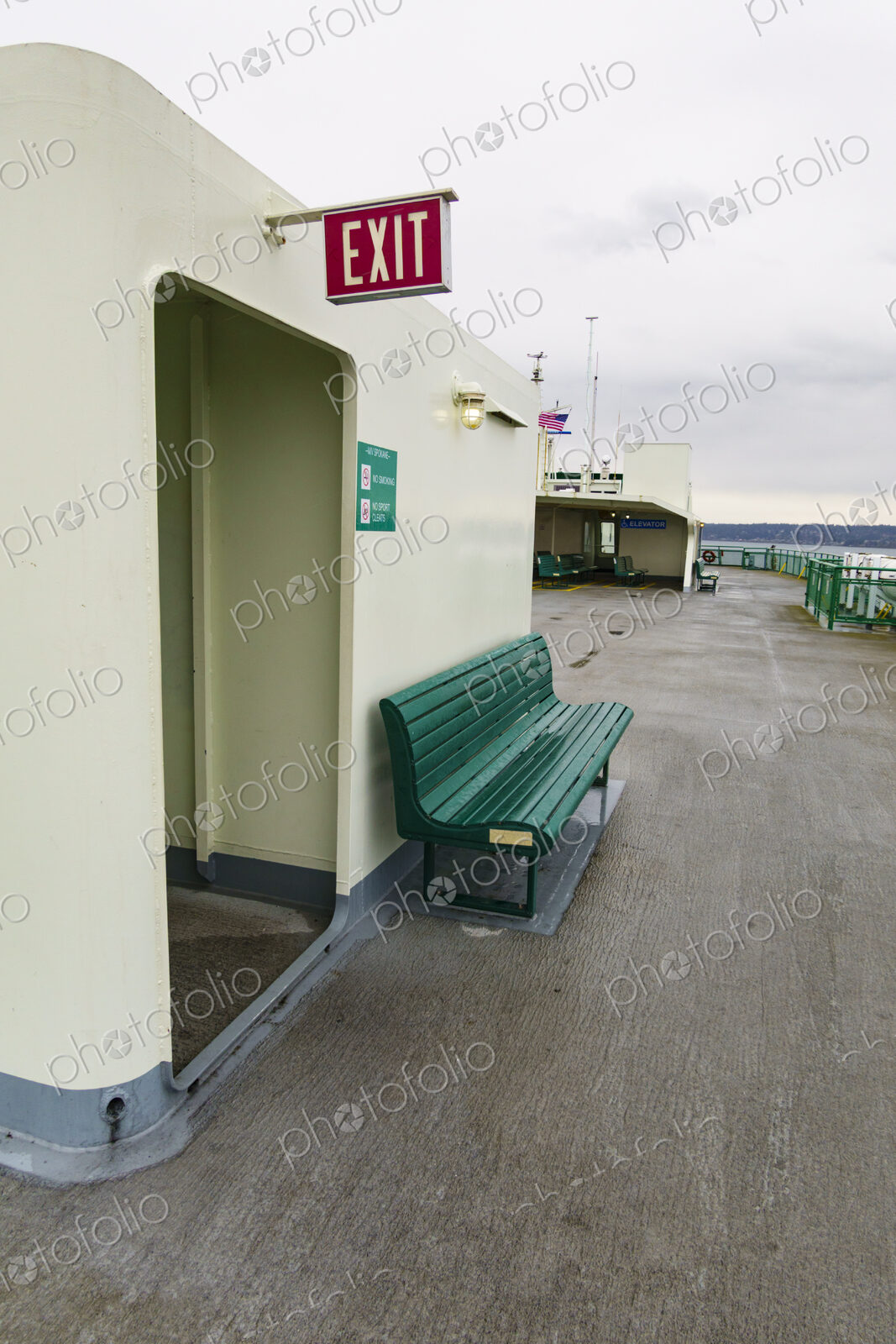 Exit sign and bench, Puget Sound ferry crossing from Edmonds to Kingston, WA USA