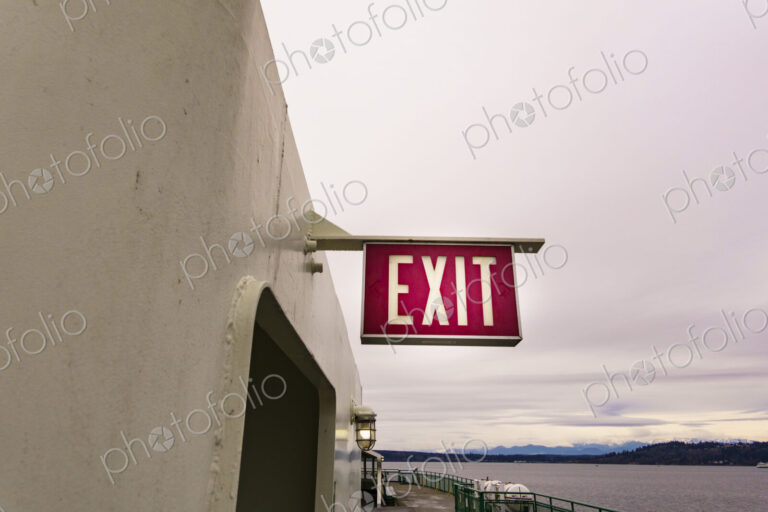 Exit sign by door entry on Puget Sound ferry, Edmonds, WA, USA