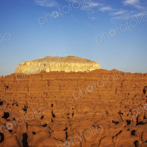 Expansive view of countless hoodoo rock formations under warm evening light, with a… Expansive view of countless hoodoo rock formations under warm evening light, with a…