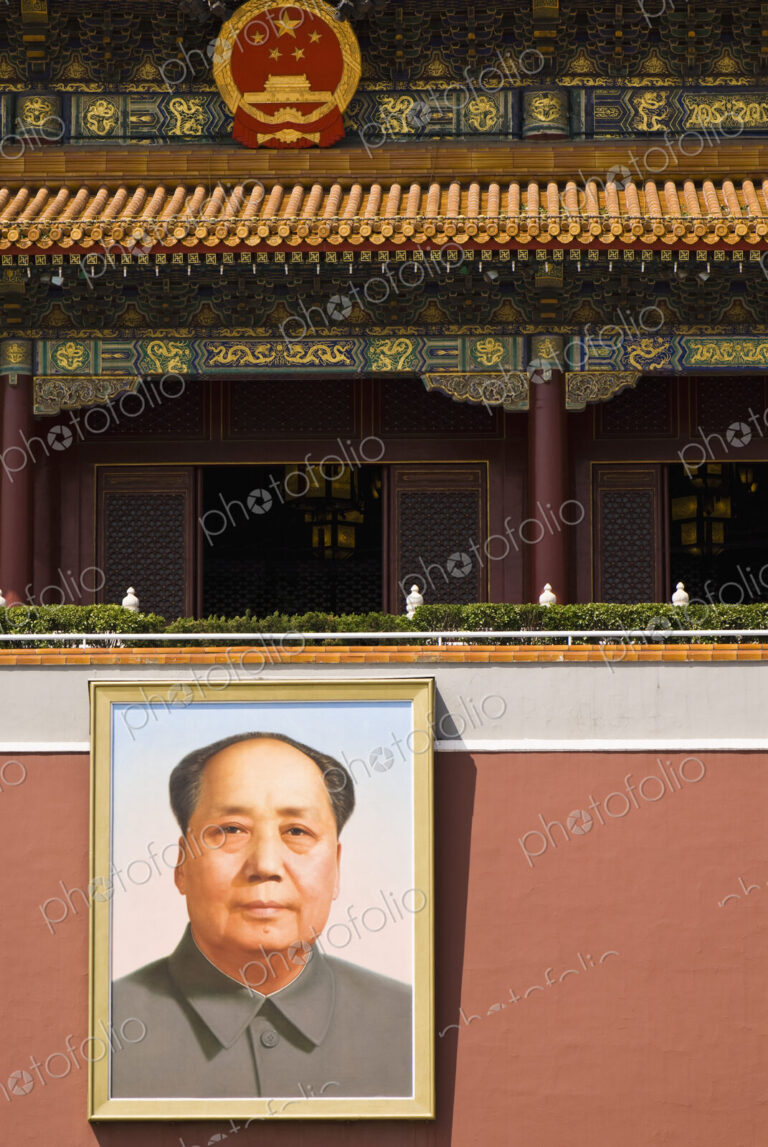 Exterior of chinese building with portrait of Chairman Mao.