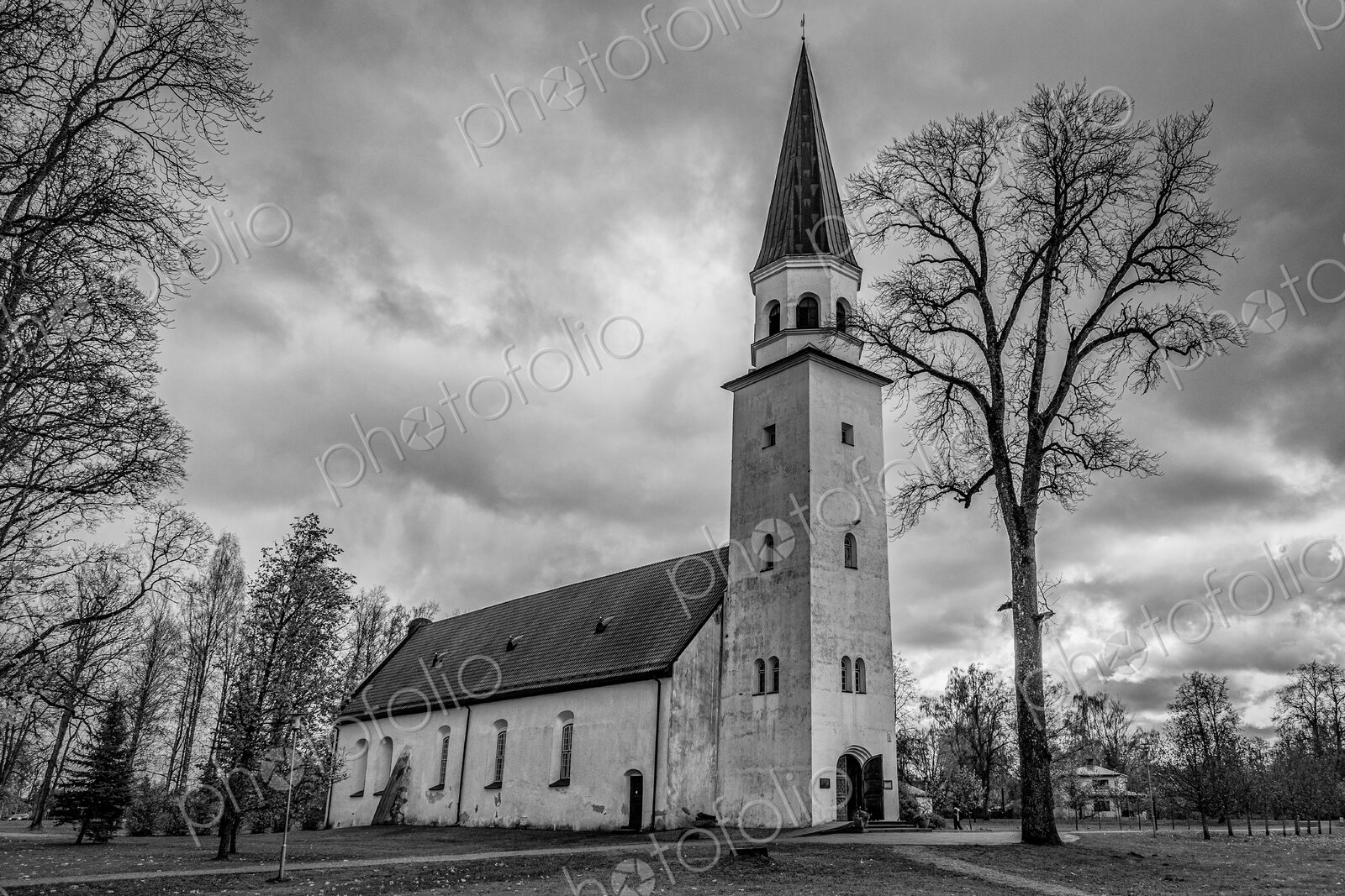 Exterior view of a church in Riga, a tall spire.