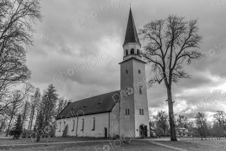 Exterior view of a church in Riga with a tall tower.