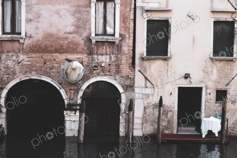 Exterior view of a neglected building on the Canale Grande in Venice, Veneto, Italy.