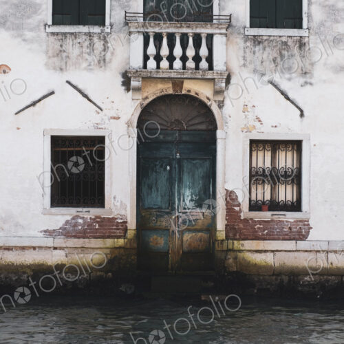 Exterior view of a neglected building on the Canale Grande in Venice, Veneto, Italy. Exterior view of a neglected building on the Canale Grande in Venice, Veneto, Italy.