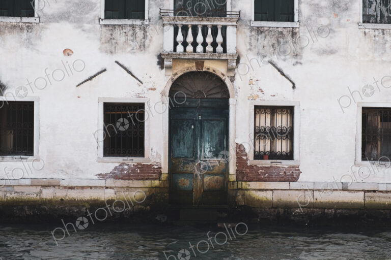 Exterior view of a neglected building on the Canale Grande in Venice, Veneto, Italy.