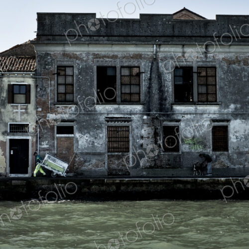 Exterior view of a neglected building on the Canale Grande in Venice, Veneto, Italy. Exterior view of a neglected building on the Canale Grande in Venice, Veneto, Italy.
