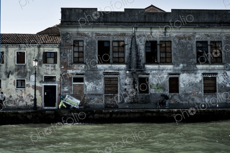 Exterior view of a neglected building on the Canale Grande in Venice, Veneto, Italy.