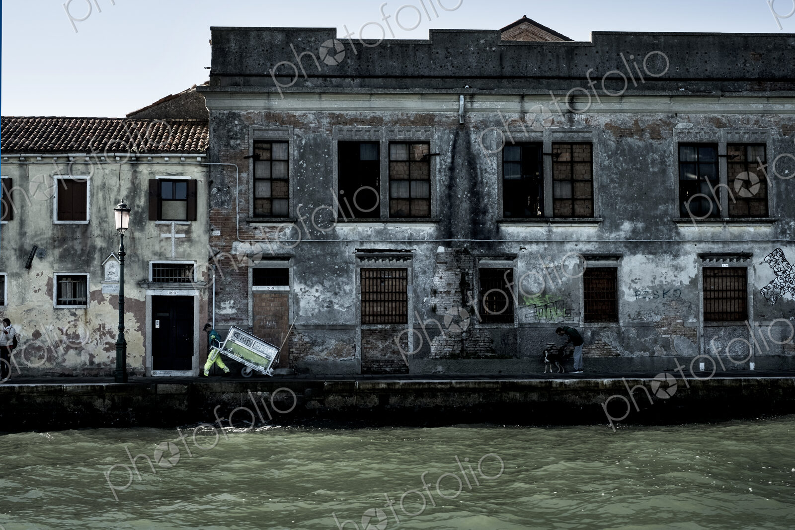Exterior view of a neglected building on the Canale Grande in Venice, Veneto, Italy.