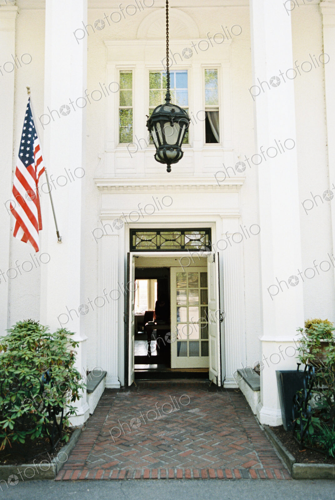 Exterior view of hotel and restaurant, A large entrance and portico.