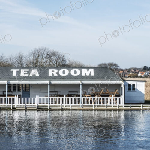 Exterior view of tea room on the shore of a lake. Exterior view of tea room on the shore of a lake.