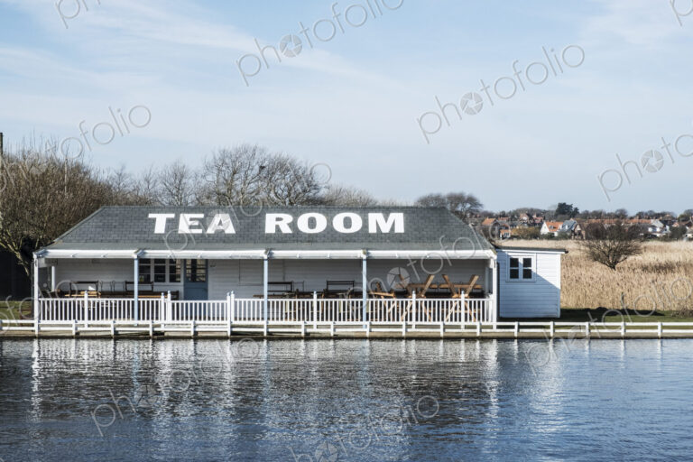 Exterior view of tea room on the shore of a lake.