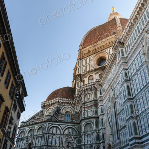 Exterior view of the Duomo in Florence, low angle view. Exterior view of the Duomo in Florence, low angle view.