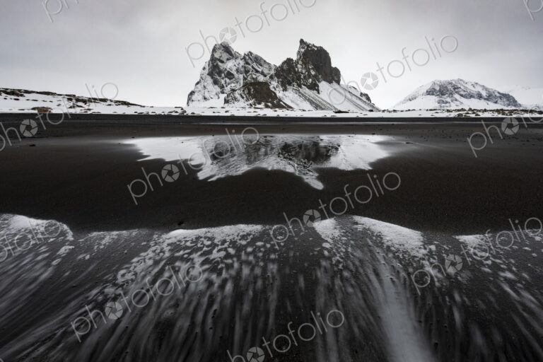 Eystrahorn mountain peak on the Hvalnes Peninsula, view from a meltwater lake,…