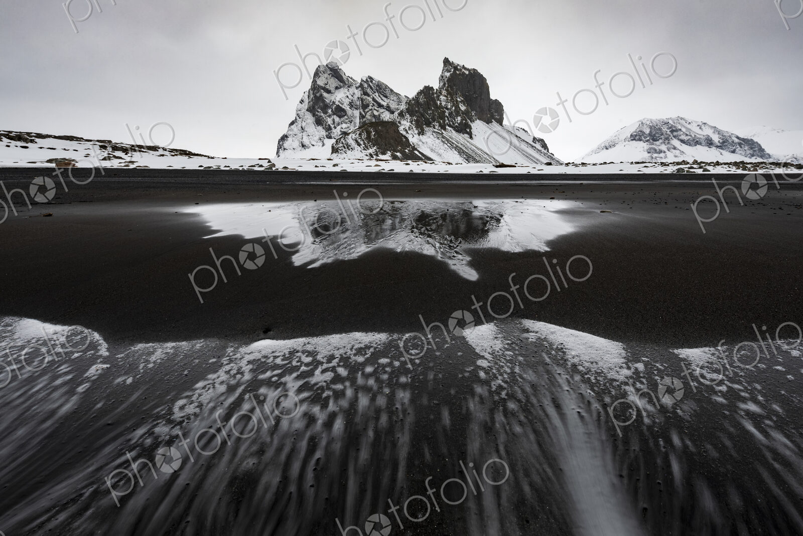 Eystrahorn mountain peak on the Hvalnes Peninsula, view from a meltwater lake,…