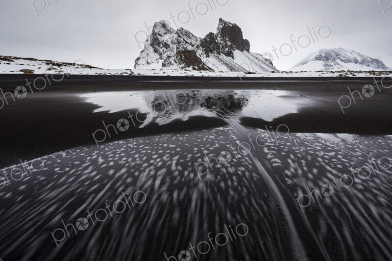 Eystrahorn mountain peak on the Hvalnes Peninsula, view from a meltwater lake,…