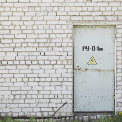 Factory Entrance With a Warning Sign Factory Entrance With a Warning Sign