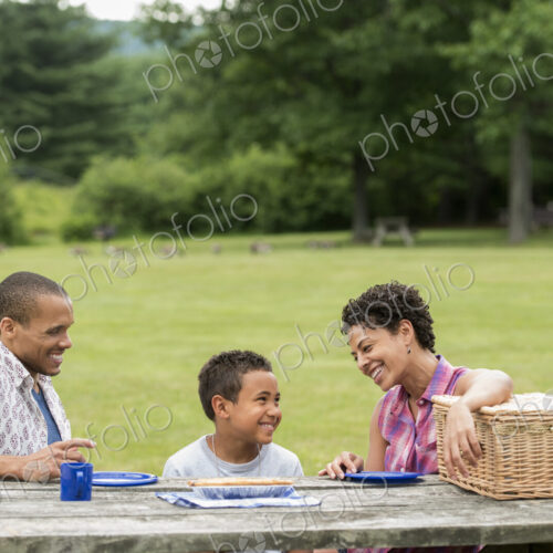 Family having a picnic in summer. Family having a picnic in summer.