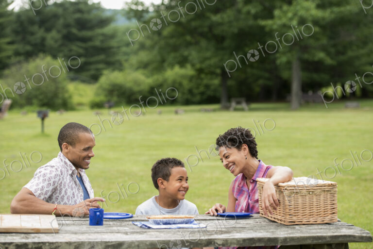 Family having a picnic in summer.