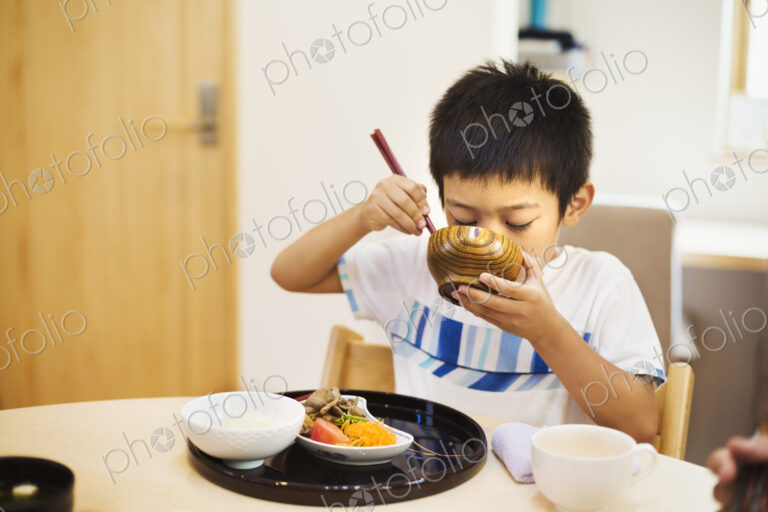 Family home. A boy eating a meal.