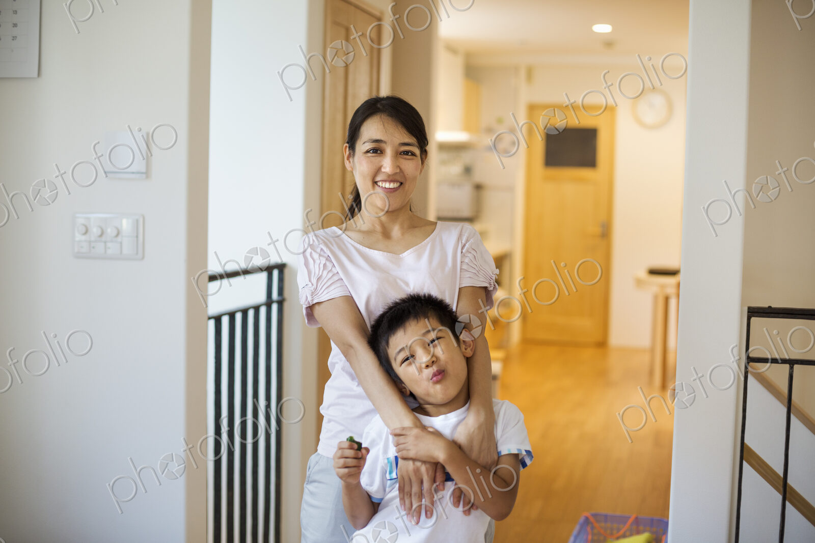 Family home. A woman and a young girl at home.