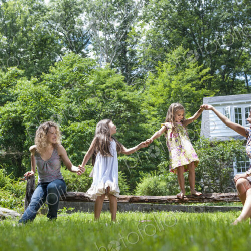 Family playing in the garden in summer.