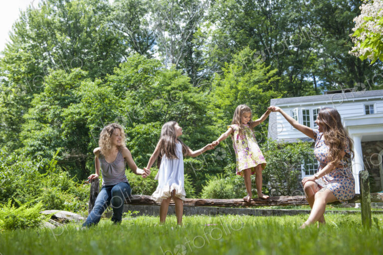 Family playing in the garden in summer.