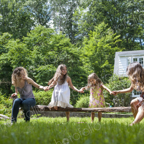 Family playing in the garden in summer.