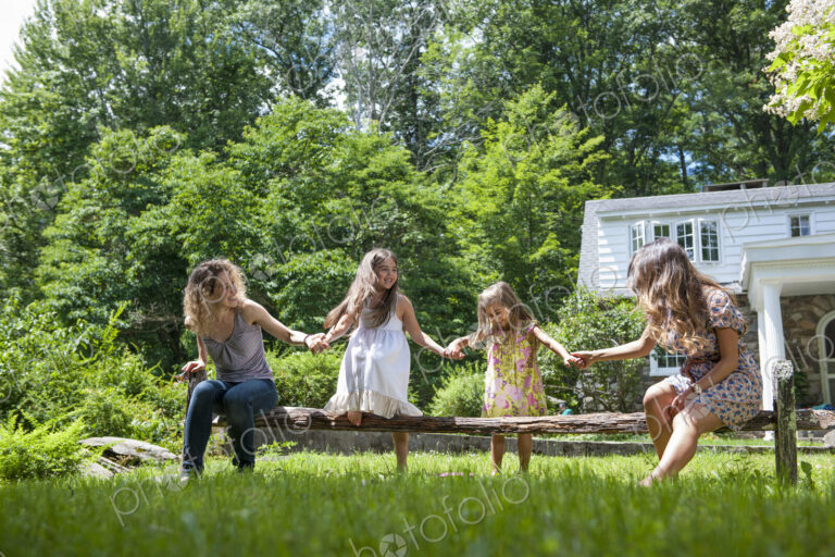 Family playing in the garden in summer.