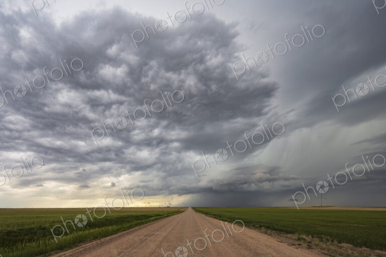 Farm Road and Developing Supercell clouds on the horizon.