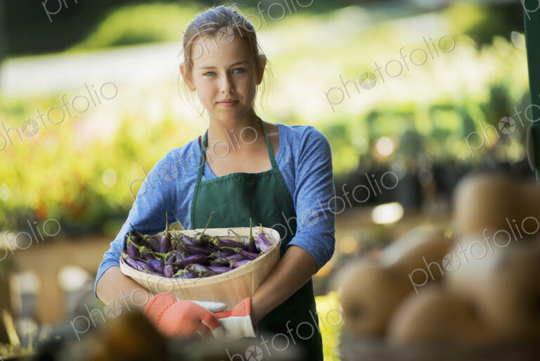 Farmer with Organic Japanese Eggplant just harvested