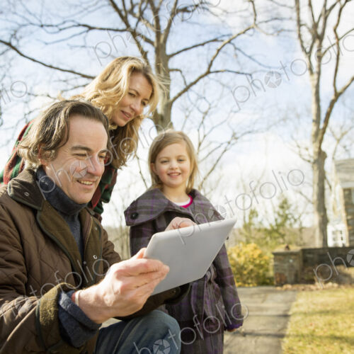 Farming family, man holding a digital tablet Farming family, man holding a digital tablet