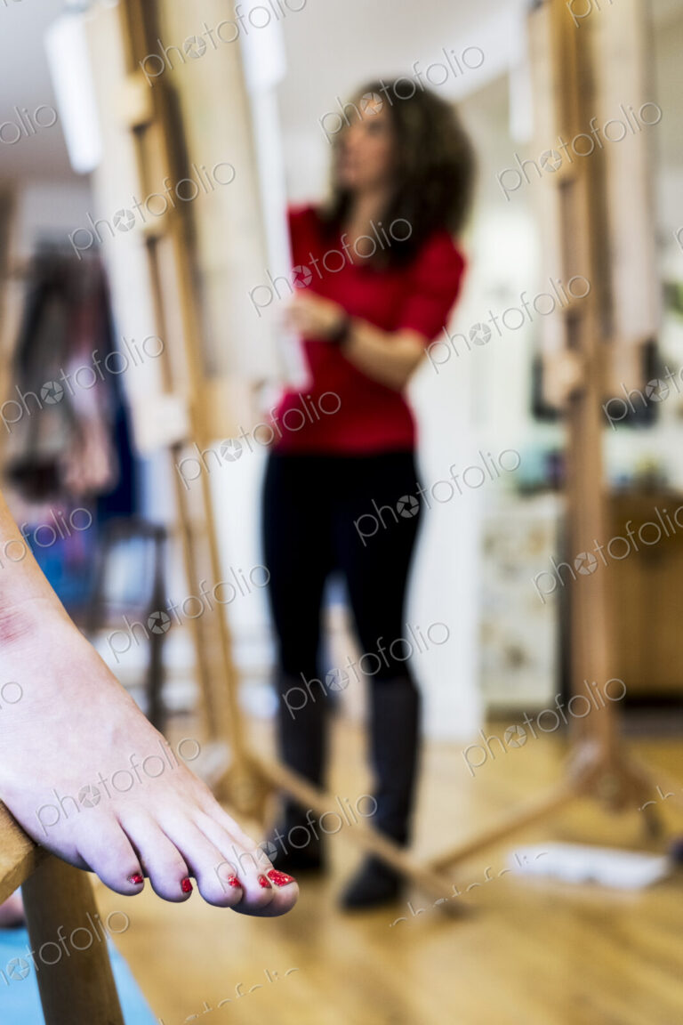 Female foot with red varnished toenails, a model at a life drawing class