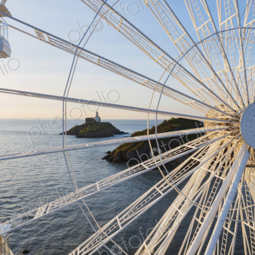 Ferris Wheel and the view through the framework to the Mumbles Lighthouse offshore