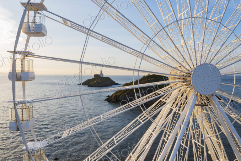 Ferris Wheel and the view through the framework to the Mumbles Lighthouse offshore