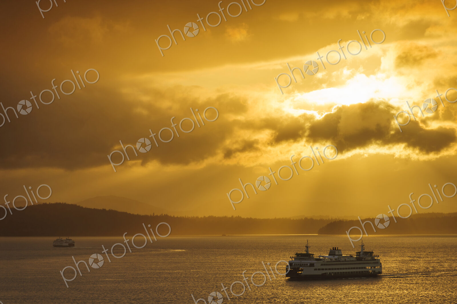 Ferry on ocean water under dramatic sky